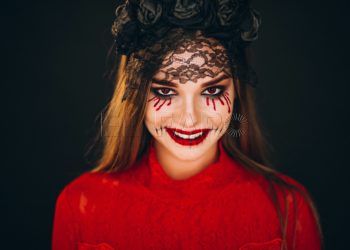 Woman in a halloween costume in studio