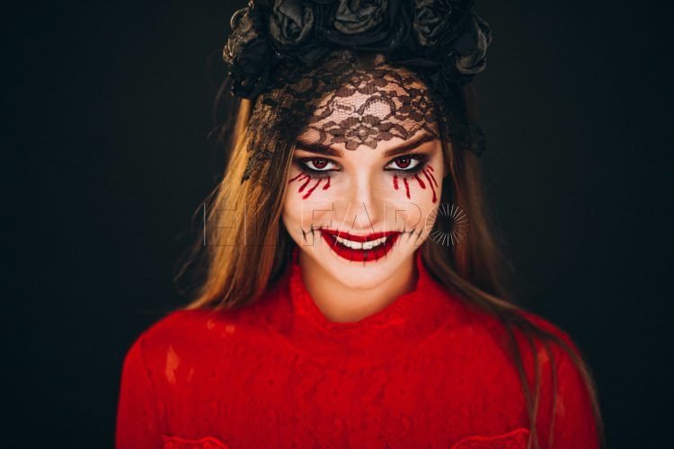 Woman in a halloween costume in studio