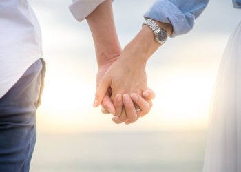 Couple holding hands