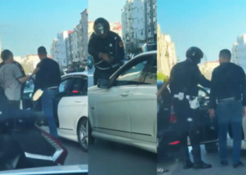 policia-tanger-apunta-arma-conductor